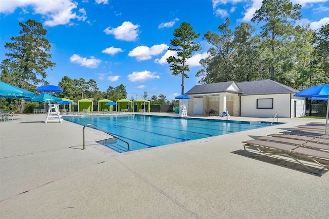 3921 Enchanted Timbers Ln, Spring, TX 77386 - community pool featuring a patio