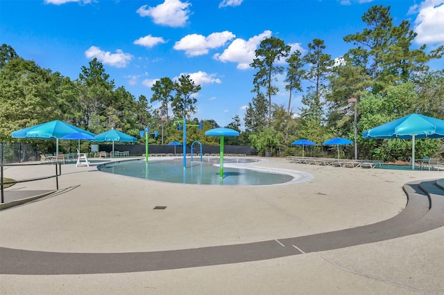3921 Enchanted Timbers Ln, Spring, TX 77386 - community pool featuring a patio
