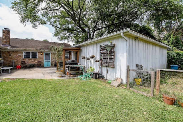 5423 Willow Creek Way, Houston, TX 77017 - rear view of house with a patio area, a chimney, and board and batten siding