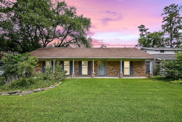 5423 Willow Creek Way, Houston, TX 77017 - ranch-style house with covered porch, a yard, brick siding, and a shingled roof