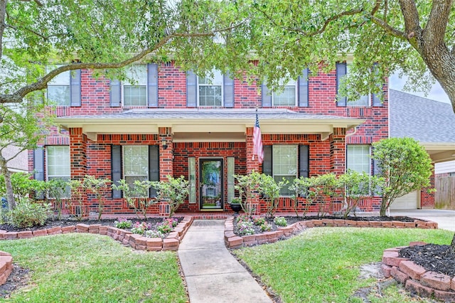8507 Marchelle Ln, Spring, TX 77379 - view of front facade featuring brick siding, a porch, and a front yard