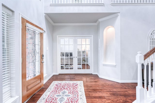 8507 Marchelle Ln, Spring, TX 77379 - foyer entrance with french doors, wood finished floors, ornamental molding, stairs, and baseboards