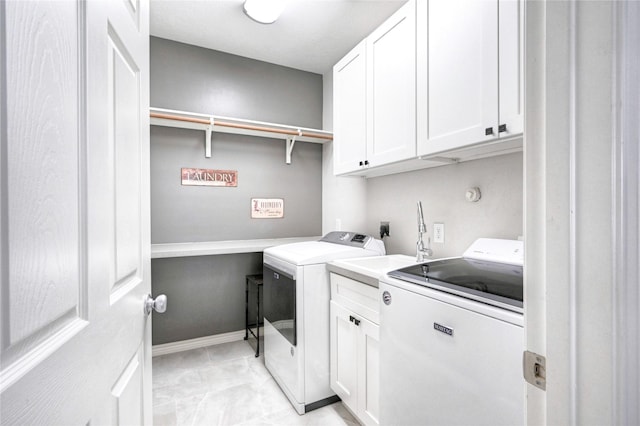 8507 Marchelle Ln, Spring, TX 77379 - laundry room with cabinet space and washing machine and dryer
