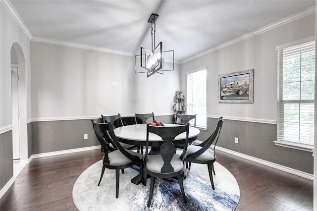 8507 Marchelle Ln, Spring, TX 77379 - dining space with wood finished floors, healthy amount of natural light, a chandelier, baseboards, and ornamental molding