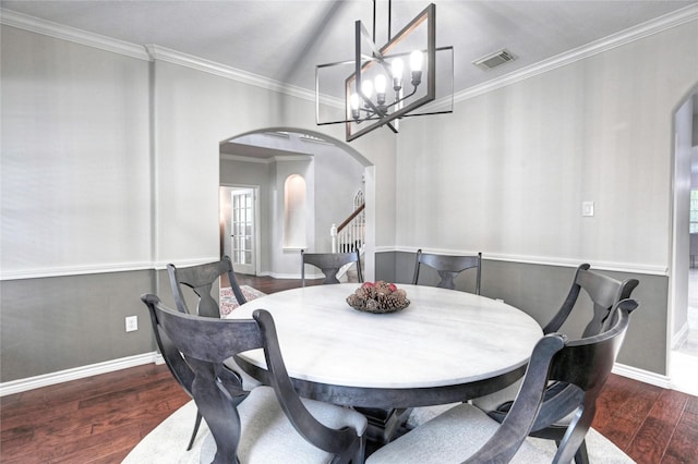 8507 Marchelle Ln, Spring, TX 77379 - dining room featuring arched walkways, wood finished floors, a chandelier, crown molding, and baseboards