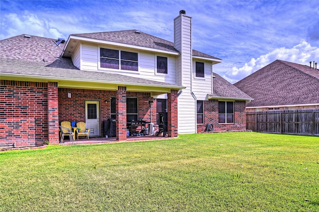 8507 Marchelle Ln, Spring, TX 77379 - rear view of property featuring brick siding, a chimney, a patio area, and a shingled roof