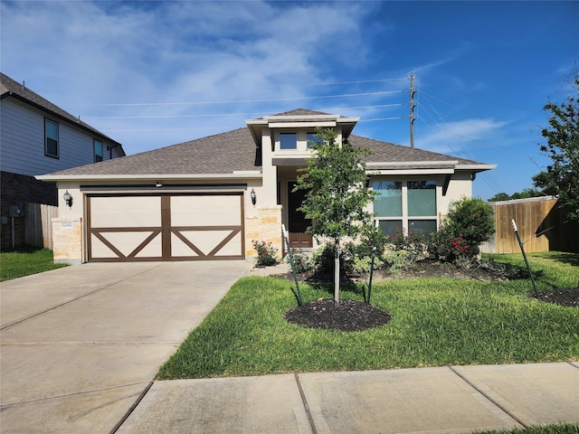 6006 Thief River Falls Dr, Katy, TX 77493 - view of front of house with an attached garage, concrete driveway, a shingled roof, and stucco siding