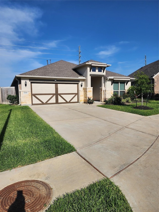 6006 Thief River Falls Dr, Katy, TX 77493 - view of front of property with stucco siding, a front yard, a garage, concrete driveway, and stone siding