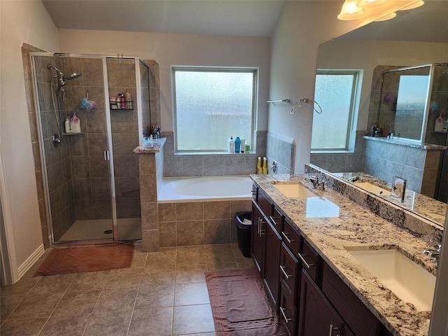 6006 Thief River Falls Dr, Katy, TX 77493 - full bathroom with healthy amount of natural light, a stall shower, a bath, and tile patterned floors