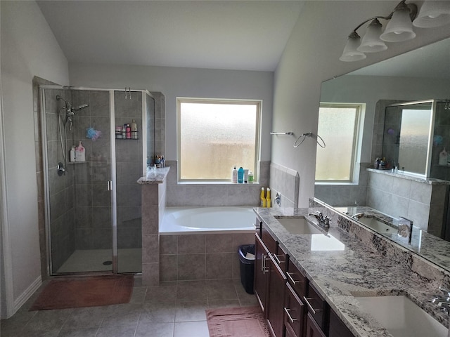 6006 Thief River Falls Dr, Katy, TX 77493 - bathroom with plenty of natural light, tile patterned floors, a garden tub, and a stall shower