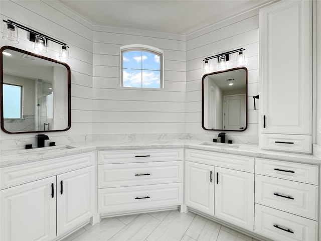 258 Monterrey Rd, Montgomery, TX 77356 - full bathroom featuring double vanity, a stall shower, marble finish floors, and crown molding