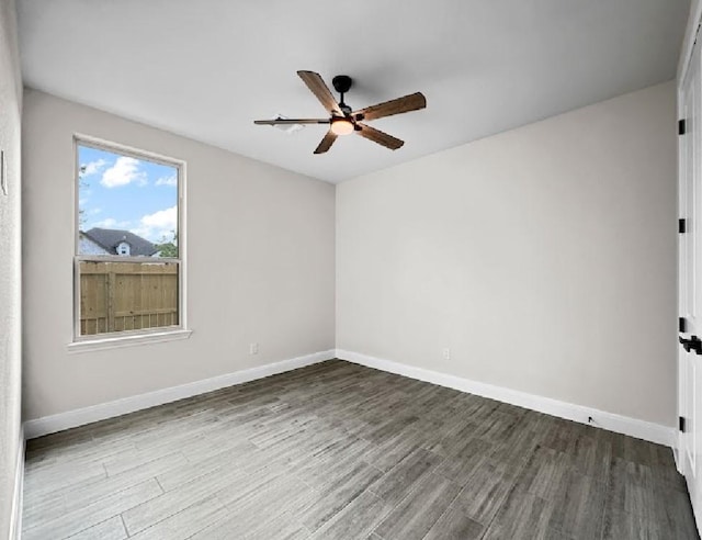 258 Monterrey Rd, Montgomery, TX 77356 - spare room featuring ceiling fan, wood finished floors, and baseboards