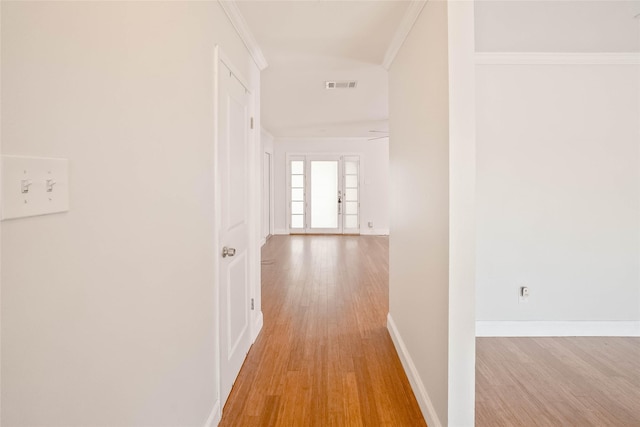 10907 Overlea Dr, Houston, TX 77089 - hallway with light wood-style floors, baseboards, and crown molding