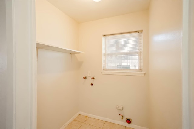 10907 Overlea Dr, Houston, TX 77089 - laundry area featuring hookup for a gas dryer, light tile patterned flooring, baseboards, and washer hookup
