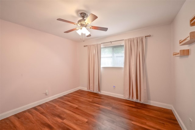 10907 Overlea Dr, Houston, TX 77089 - empty room with ceiling fan, wood finished floors, and baseboards