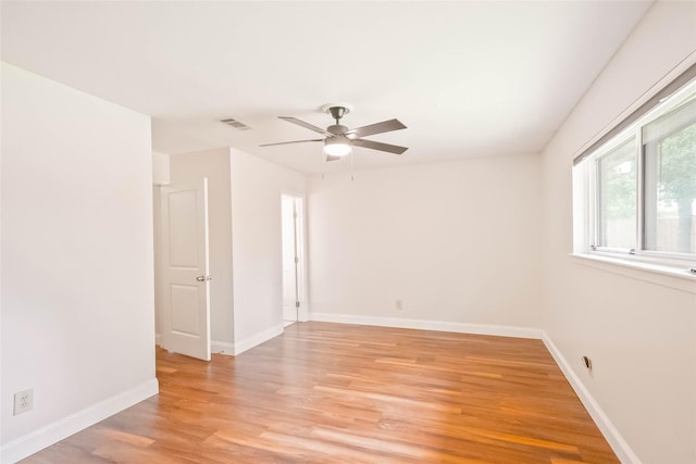 10907 Overlea Dr, Houston, TX 77089 - spare room with light wood-style floors, a ceiling fan, and baseboards