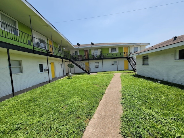 6706 Ralston St, Houston, TX 77016 - view of green lawn featuring stairway