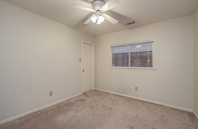 10829 E Linwood Dr, La Porte, TX 77571 - unfurnished room featuring light colored carpet, baseboards, and ceiling fan