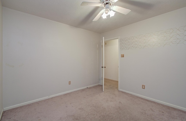 10829 E Linwood Dr, La Porte, TX 77571 - unfurnished room featuring light colored carpet, ceiling fan, and baseboards