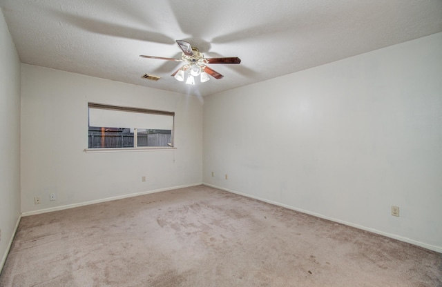 10829 E Linwood Dr, La Porte, TX 77571 - spare room with carpet, a ceiling fan, and baseboards
