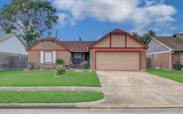 10829 E Linwood Dr, La Porte, TX 77571 - view of front of property featuring brick siding, a garage, driveway, and a front yard