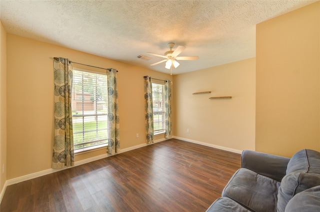24014 Whitefield Ln, Katy, TX 77493 - living room featuring wood finished floors, a ceiling fan, a textured ceiling, and baseboards
