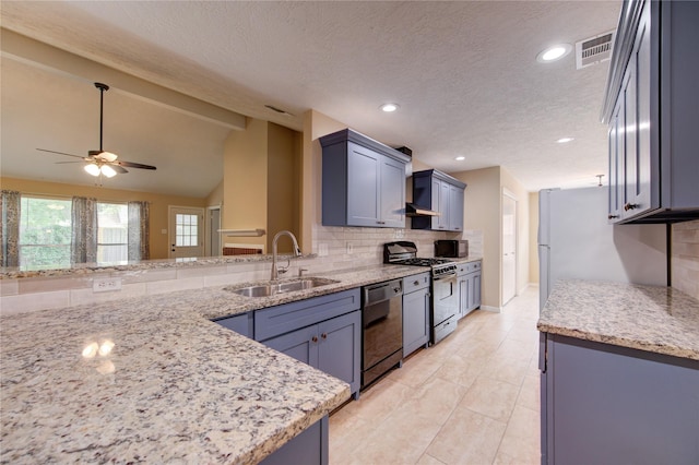 24014 Whitefield Ln, Katy, TX 77493 - kitchen featuring black appliances, a sink, backsplash, ceiling fan, and light stone counters