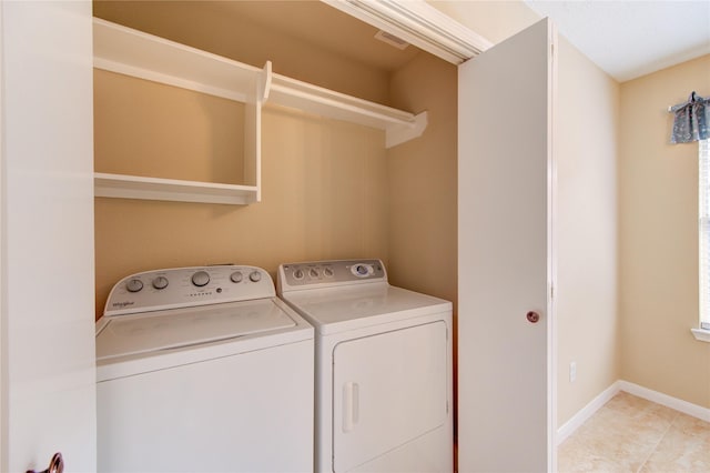 24014 Whitefield Ln, Katy, TX 77493 - washroom featuring independent washer and dryer, baseboards, and light tile patterned floors