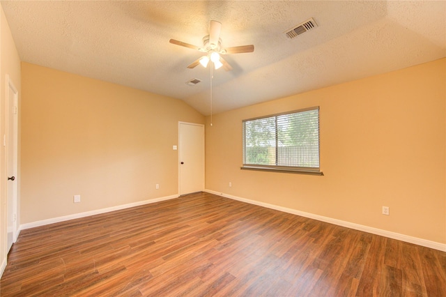 24014 Whitefield Ln, Katy, TX 77493 - empty room with wood finished floors, a textured ceiling, a ceiling fan, baseboards, and vaulted ceiling