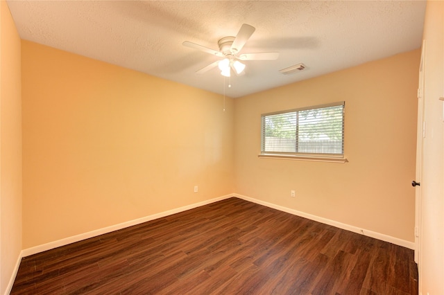 24014 Whitefield Ln, Katy, TX 77493 - empty room with dark wood-style flooring, a textured ceiling, baseboards, and ceiling fan