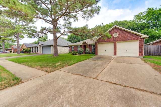 24014 Whitefield Ln, Katy, TX 77493 - view of front facade with brick siding, concrete driveway, and an attached garage