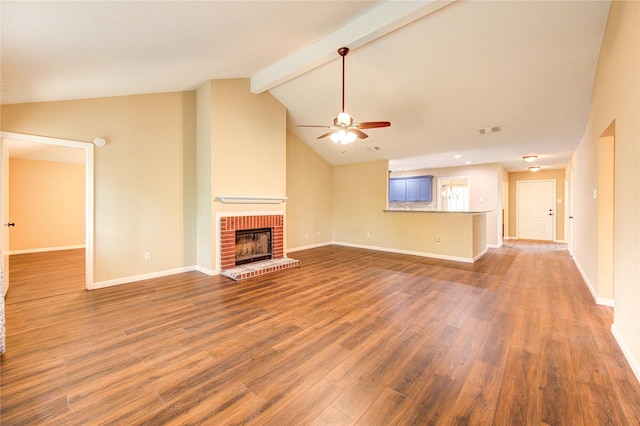 24014 Whitefield Ln, Katy, TX 77493 - unfurnished living room with a ceiling fan, a fireplace, dark wood-style floors, and baseboards