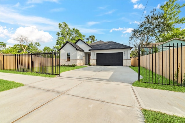 8106 Talton St, Houston, TX 77028 - view of front of house featuring driveway, stucco siding, a garage, and stone siding