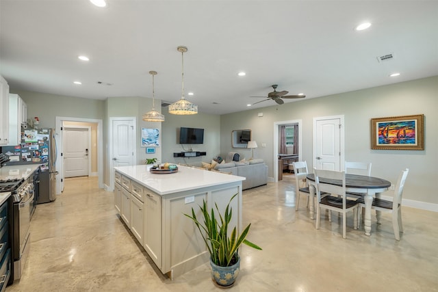 5292 Horseshoe Dr, Anderson, TX 77830 - kitchen with appliances with stainless steel finishes, ceiling fan, recessed lighting, baseboards, and a center island