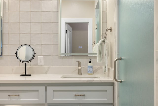 5292 Horseshoe Dr, Anderson, TX 77830 - bathroom featuring tasteful backsplash, vanity, and a shower with door