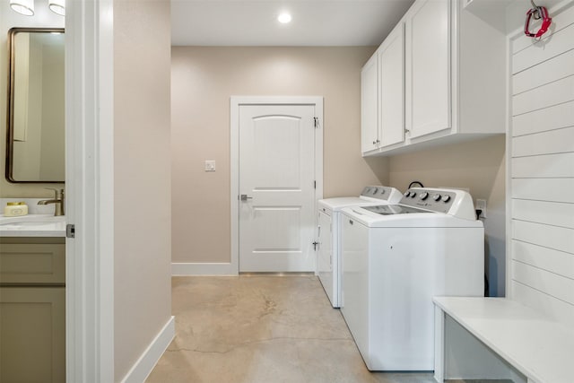 5292 Horseshoe Dr, Anderson, TX 77830 - washroom with baseboards, cabinet space, separate washer and dryer, and recessed lighting