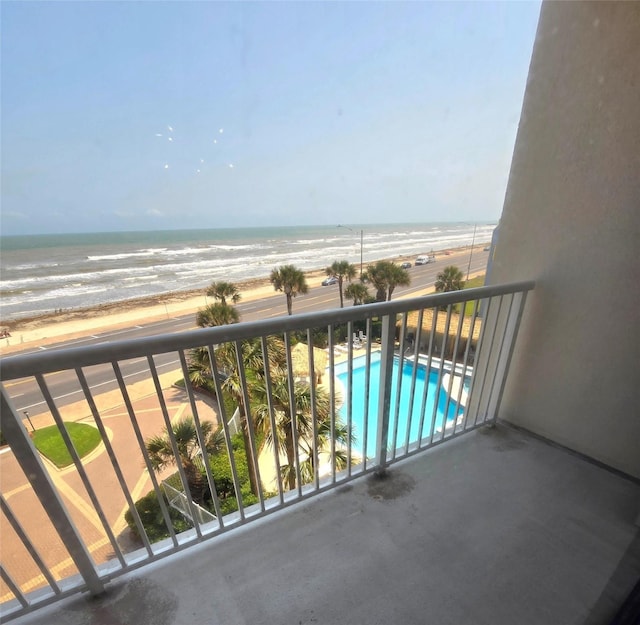 7700 Seawall Blvd Unit 409, Galveston, TX 77551 - balcony with view of water and beach and view of pool area