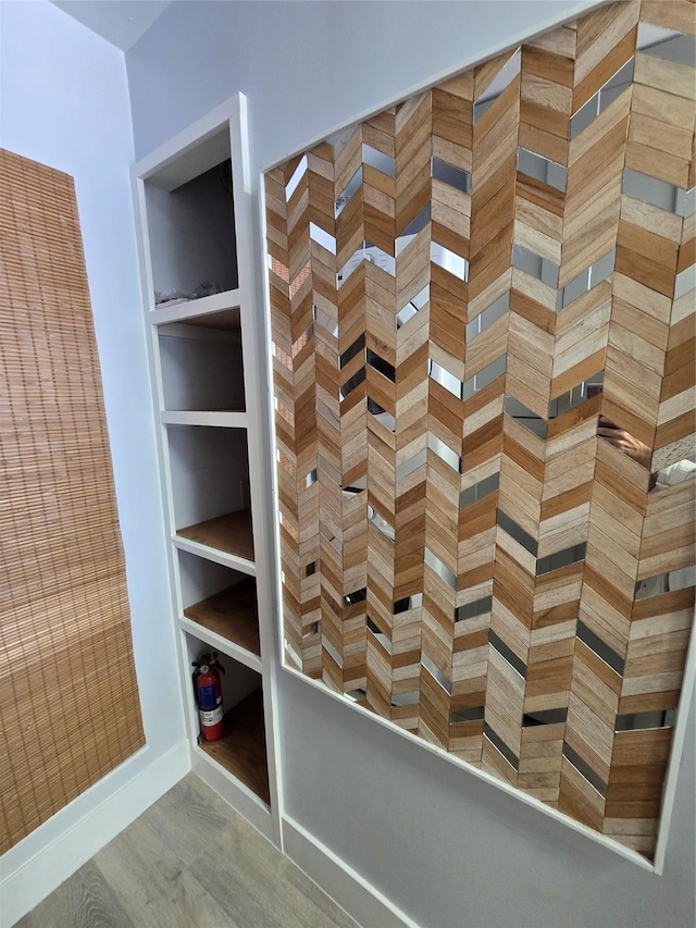 7700 Seawall Blvd Unit 409, Galveston, TX 77551 - bathroom with wood finished floors and baseboards