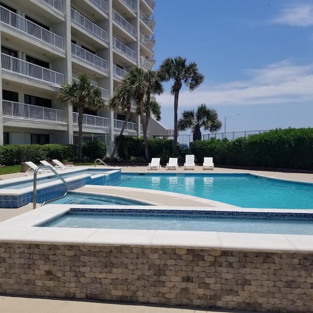 7700 Seawall Blvd Unit 409, Galveston, TX 77551 - community pool featuring a community hot tub