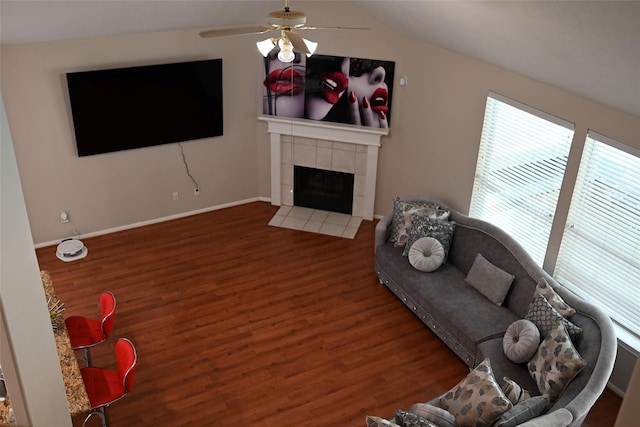 15827 Heartwood Way, Cypress, TX 77433 - living room featuring healthy amount of natural light, ceiling fan, wood finished floors, a tiled fireplace, and vaulted ceiling