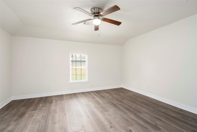 798 Fair St, Houston, TX 77088 - unfurnished room featuring vaulted ceiling, dark wood-style flooring, a ceiling fan, and baseboards