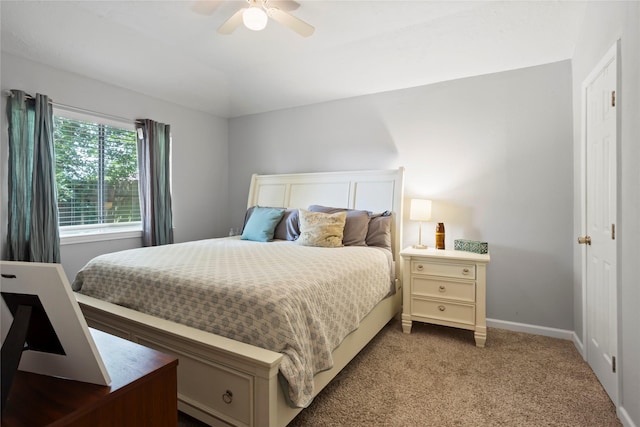 5403 Carousel Cir, Baytown, TX 77521 - bedroom with carpet floors, baseboards, and a ceiling fan