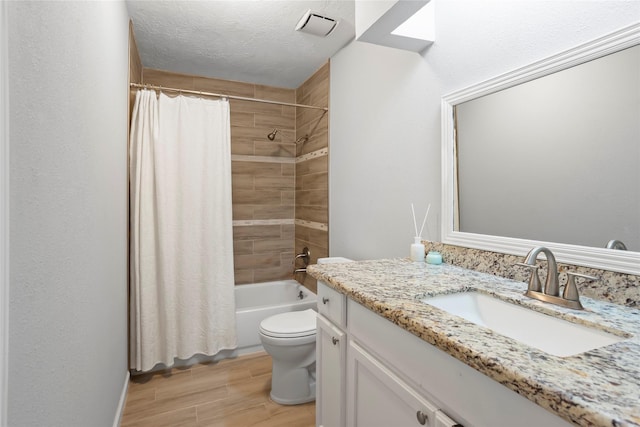 5403 Carousel Cir, Baytown, TX 77521 - full bath with wood finished floors, vanity, toilet, and shower / bath combo