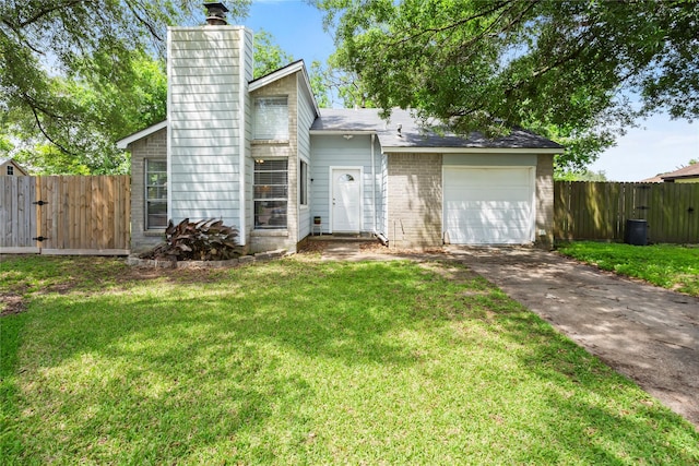 5403 Carousel Cir, Baytown, TX 77521 - back of house with driveway, a chimney, a garage, and brick siding