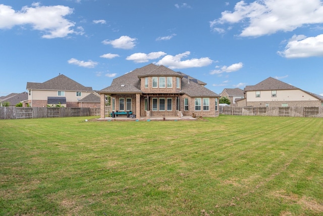 5803 Platinum Lakes Ct, Rosenberg, TX 77469 - rear view of house with a patio and brick siding