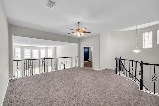5803 Platinum Lakes Ct, Rosenberg, TX 77469 - empty room with carpet flooring, plenty of natural light, a ceiling fan, and baseboards
