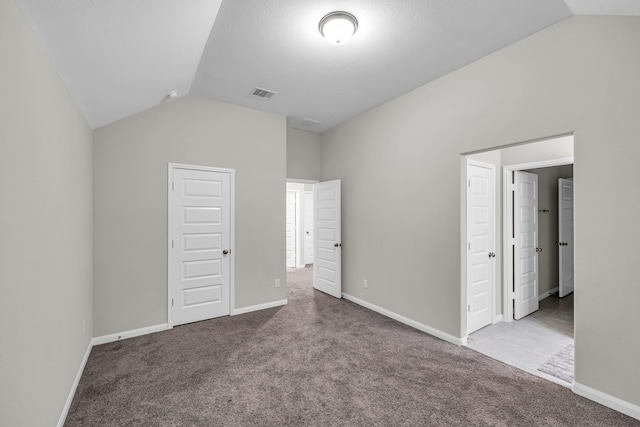 5803 Platinum Lakes Ct, Rosenberg, TX 77469 - unfurnished bedroom with lofted ceiling, carpet floors, and baseboards