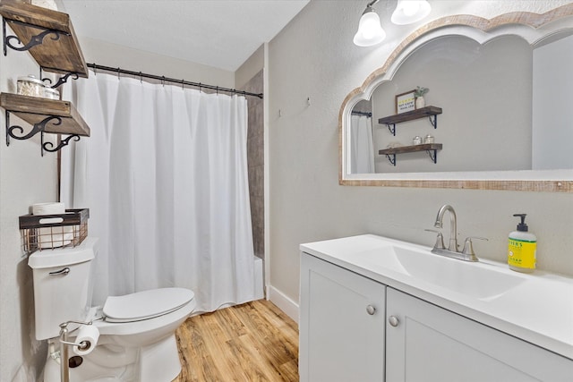 14440 Fm 1696th Rd, Bedias, TX 77831 - bathroom featuring toilet, vanity, wood finished floors, and shower / bath combination with curtain