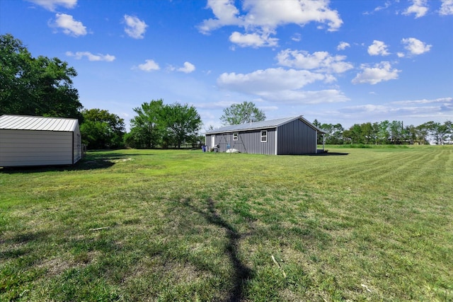 14440 Fm 1696th Rd, Bedias, TX 77831 - view of green lawn with an outdoor structure and an outbuilding