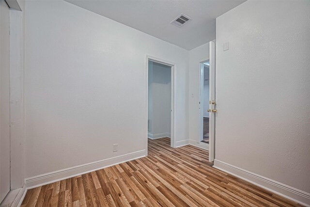 1029 Dolly Wright St, Houston, TX 77088 - spare room featuring wood finished floors and baseboards